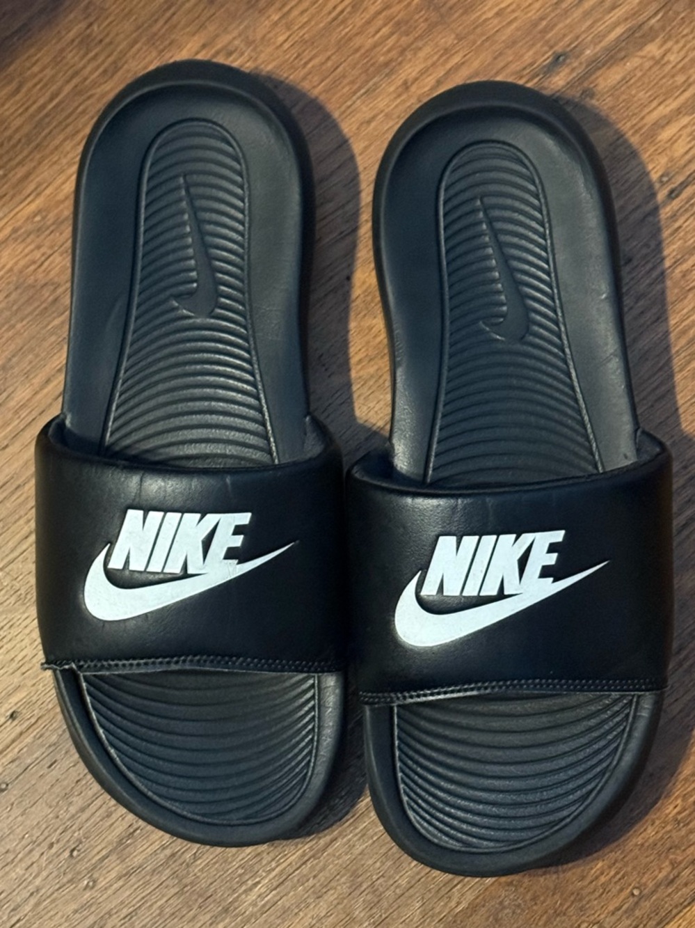Nike Black and White Slip-On Sneakers with Branded Tongue Tag